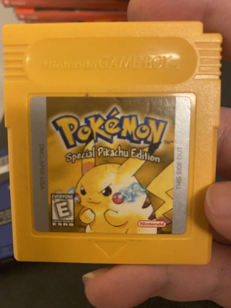 A yellow Game Boy cartridge, with "Pokemon: Special Pikachu Edition" on it.